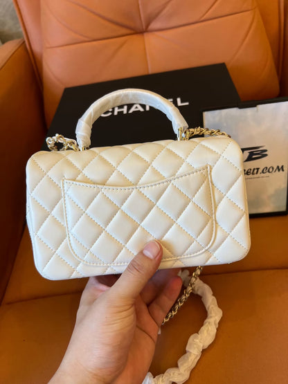 Chanel white quilted lambskin top handle mini flap bag