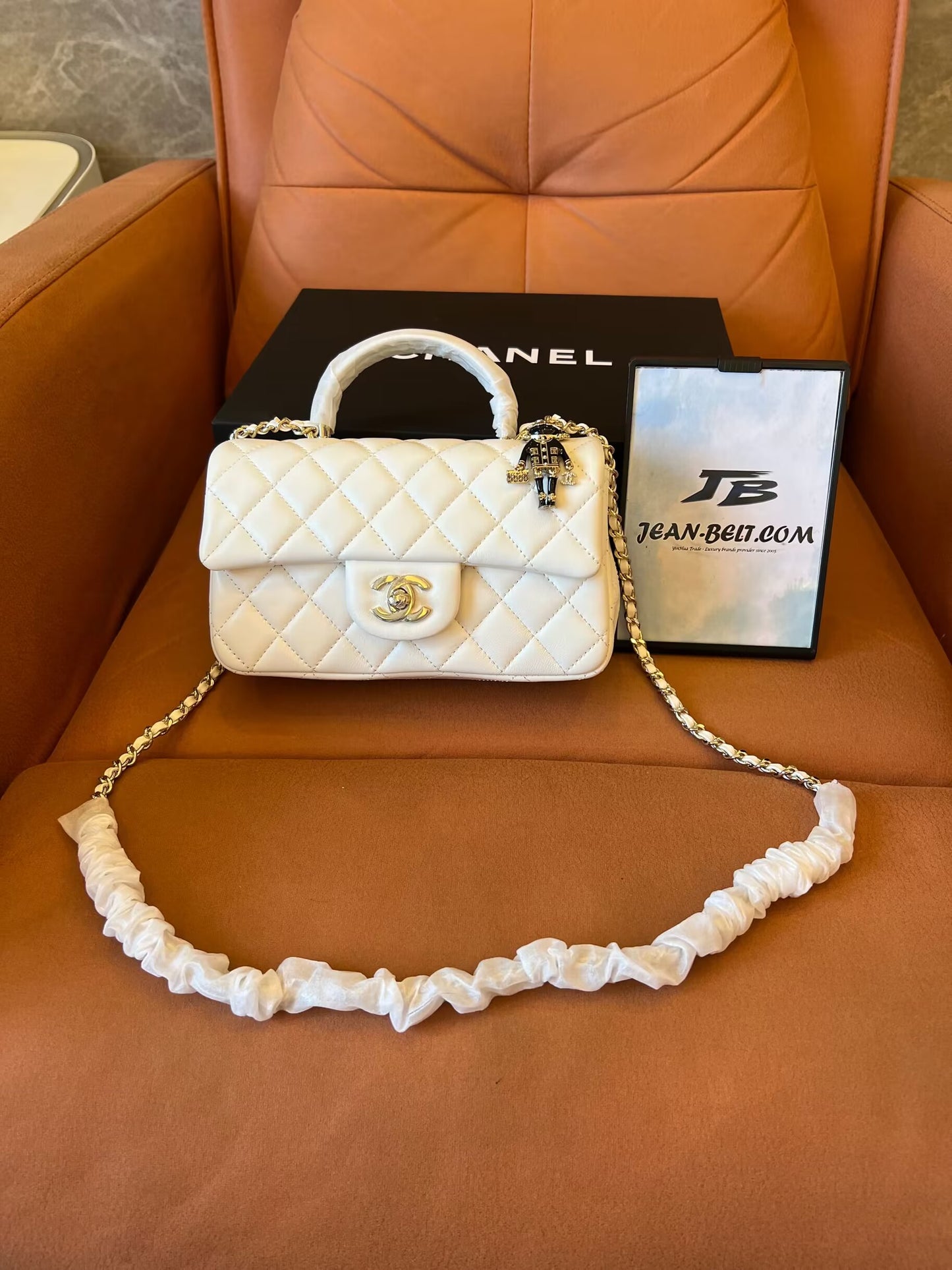 Chanel white quilted lambskin top handle mini flap bag