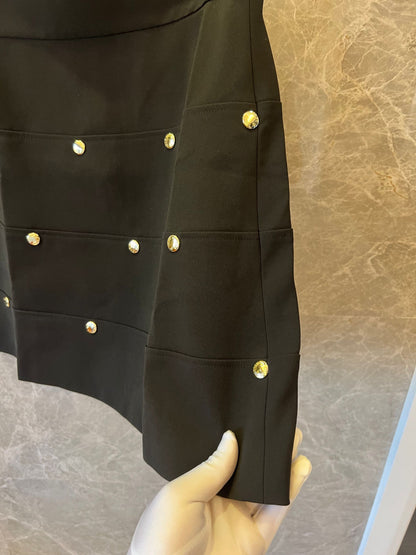 Louis Vuitton black mini skirt with gold zipper and monogram accents