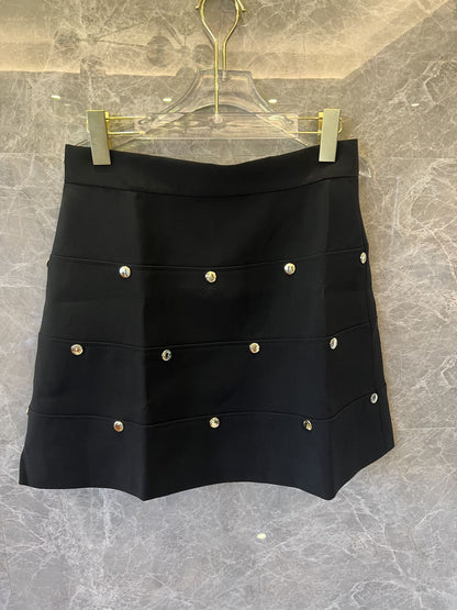 Louis Vuitton black mini skirt with gold zipper and monogram accents