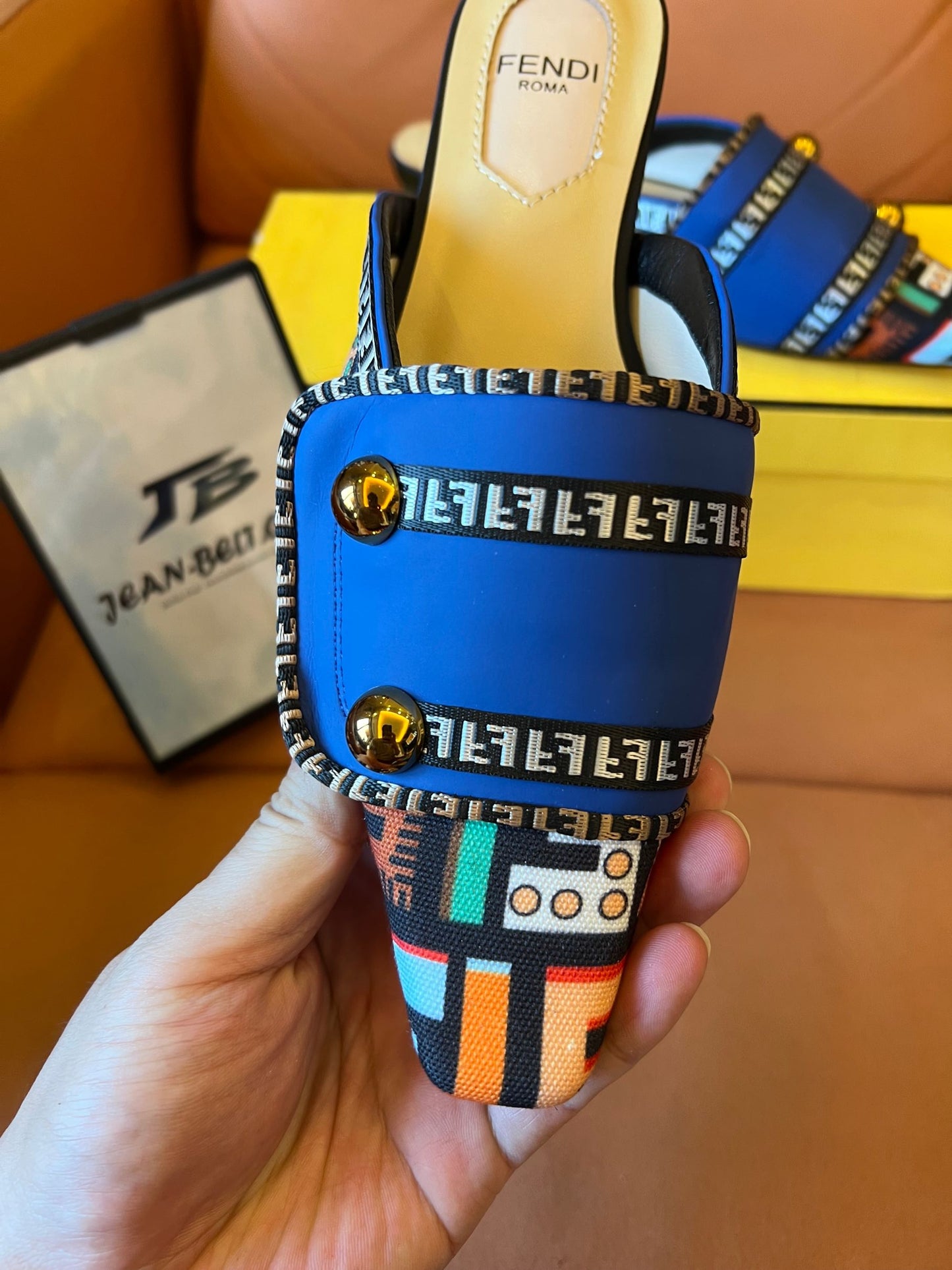 Fendi women's blue slide sandals with patterned straps and gold accents