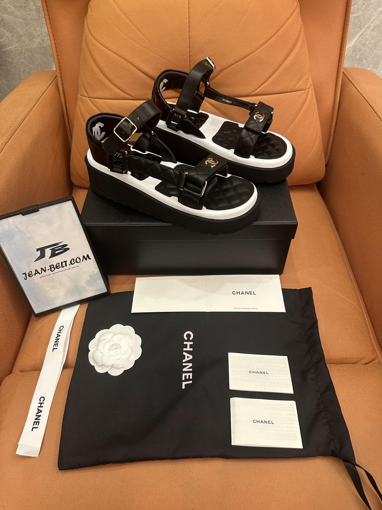 Chanel lambskin logo platform sandals black white