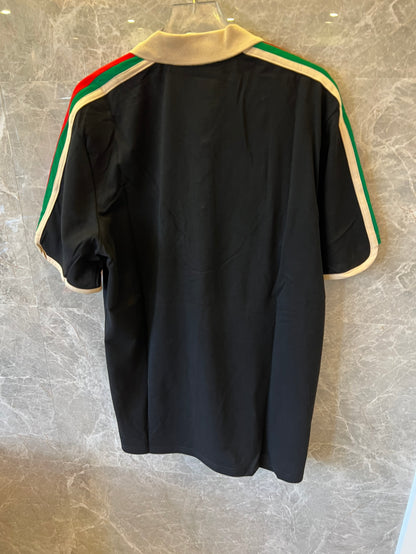 Gucci black polo shirt with iconic web stripes