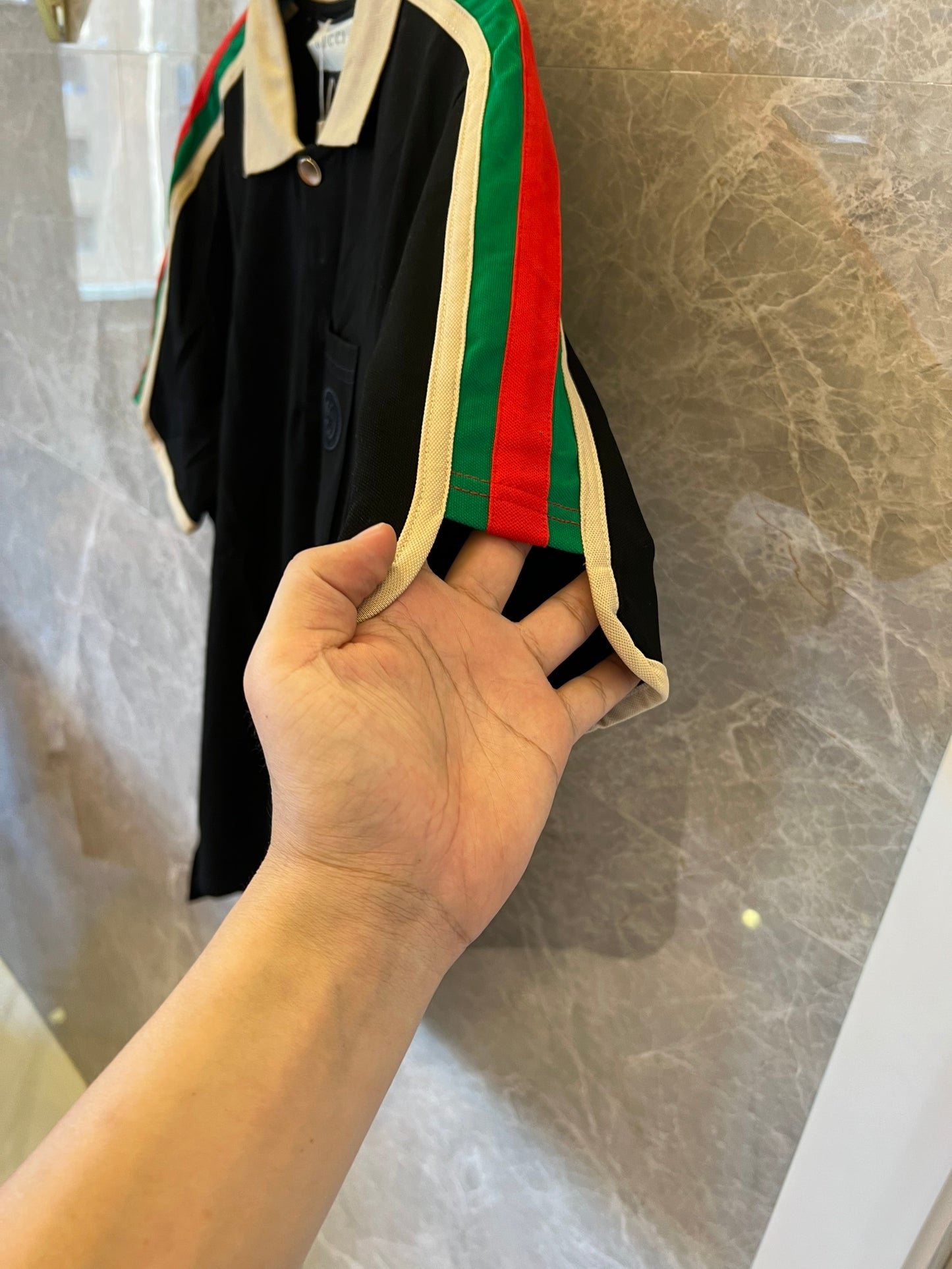 Gucci black polo shirt with iconic web stripes