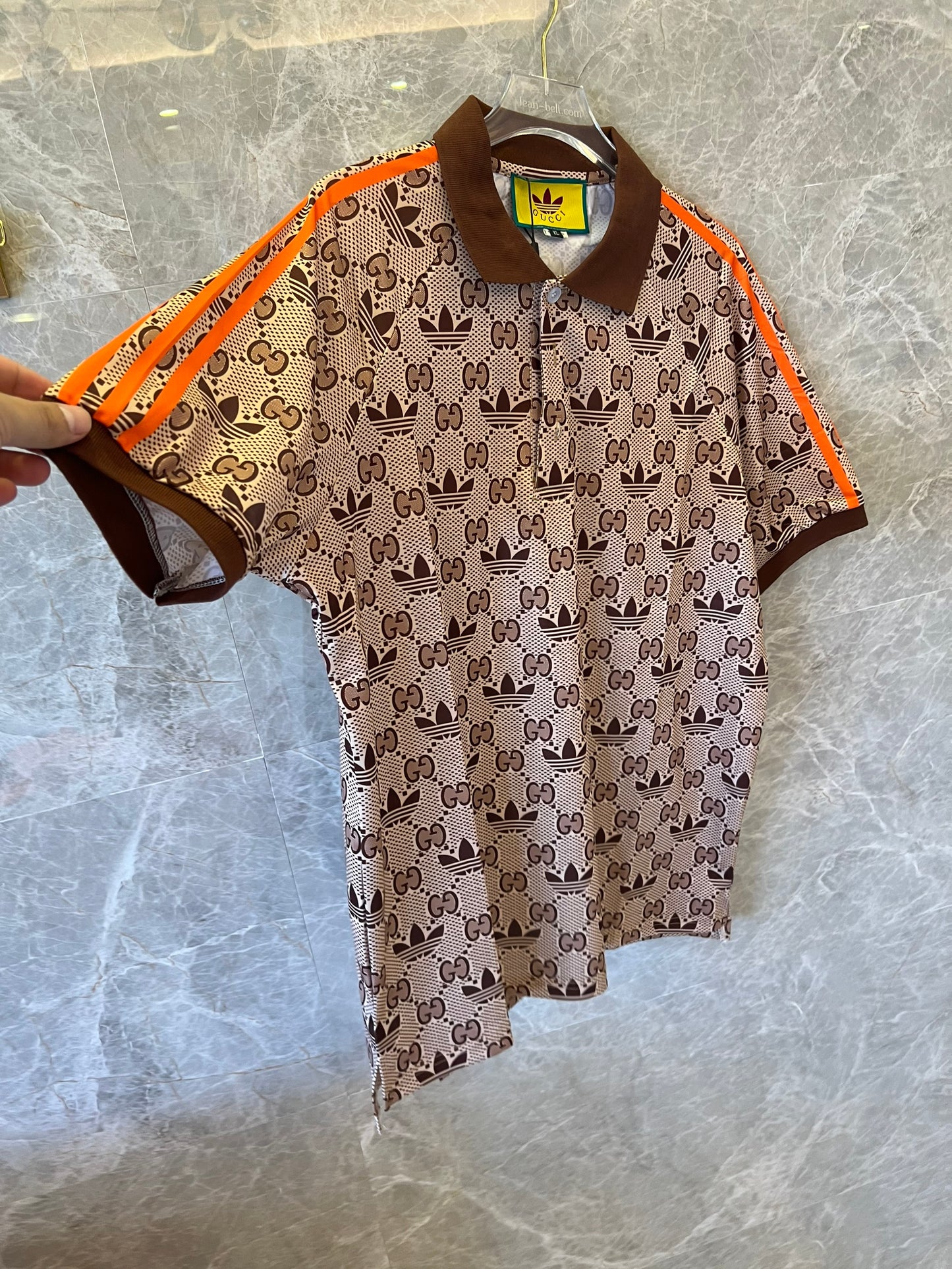 Gucci x Adidas brown monogram polo shirt with orange trim and trefoil logos