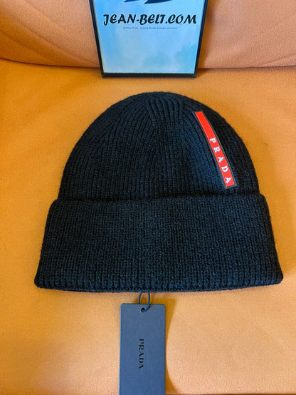 Prada black knitted wool beanie with signature red stripe logo