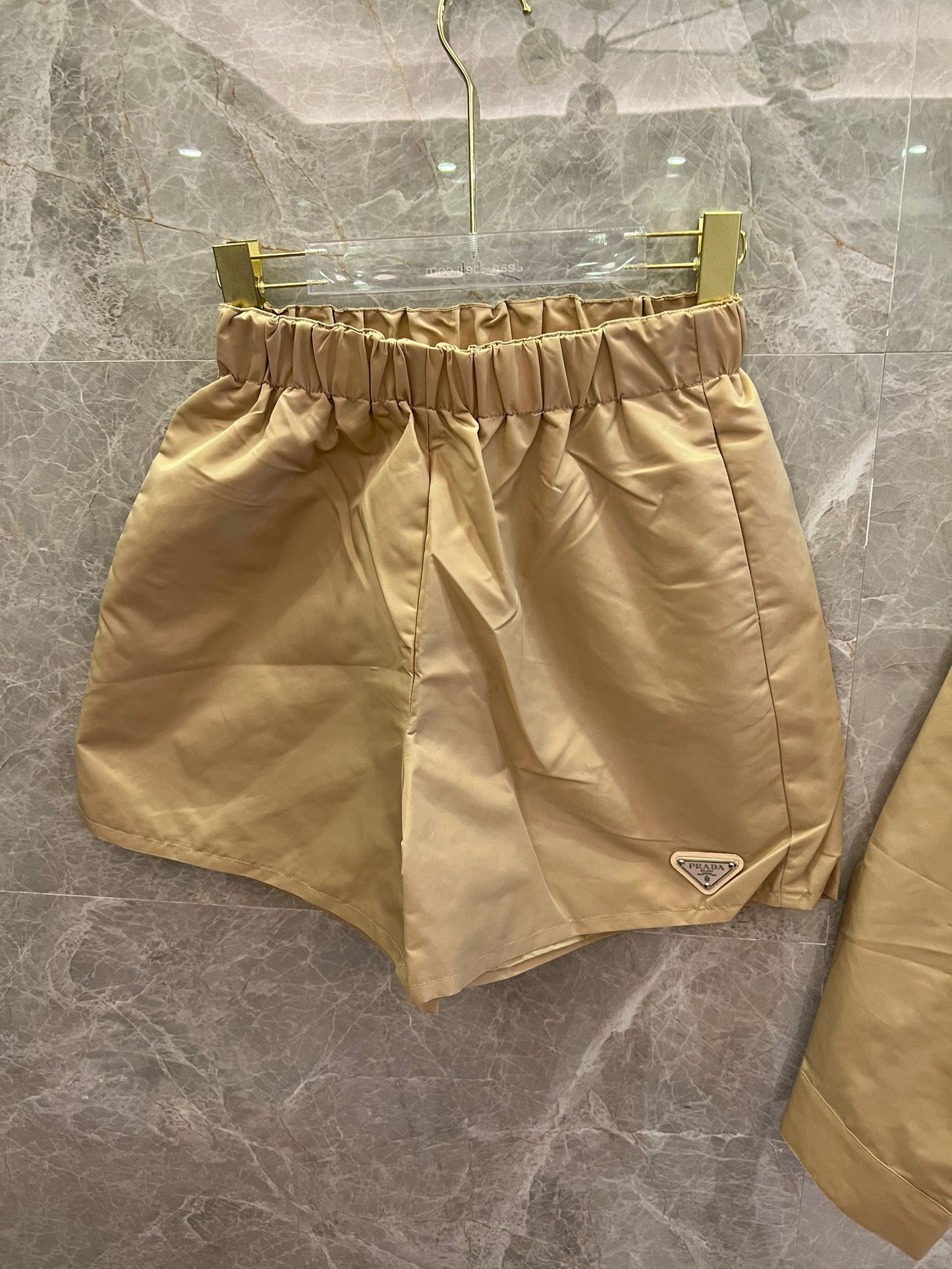 rada beige nylon crop jacket and high-waisted shorts set