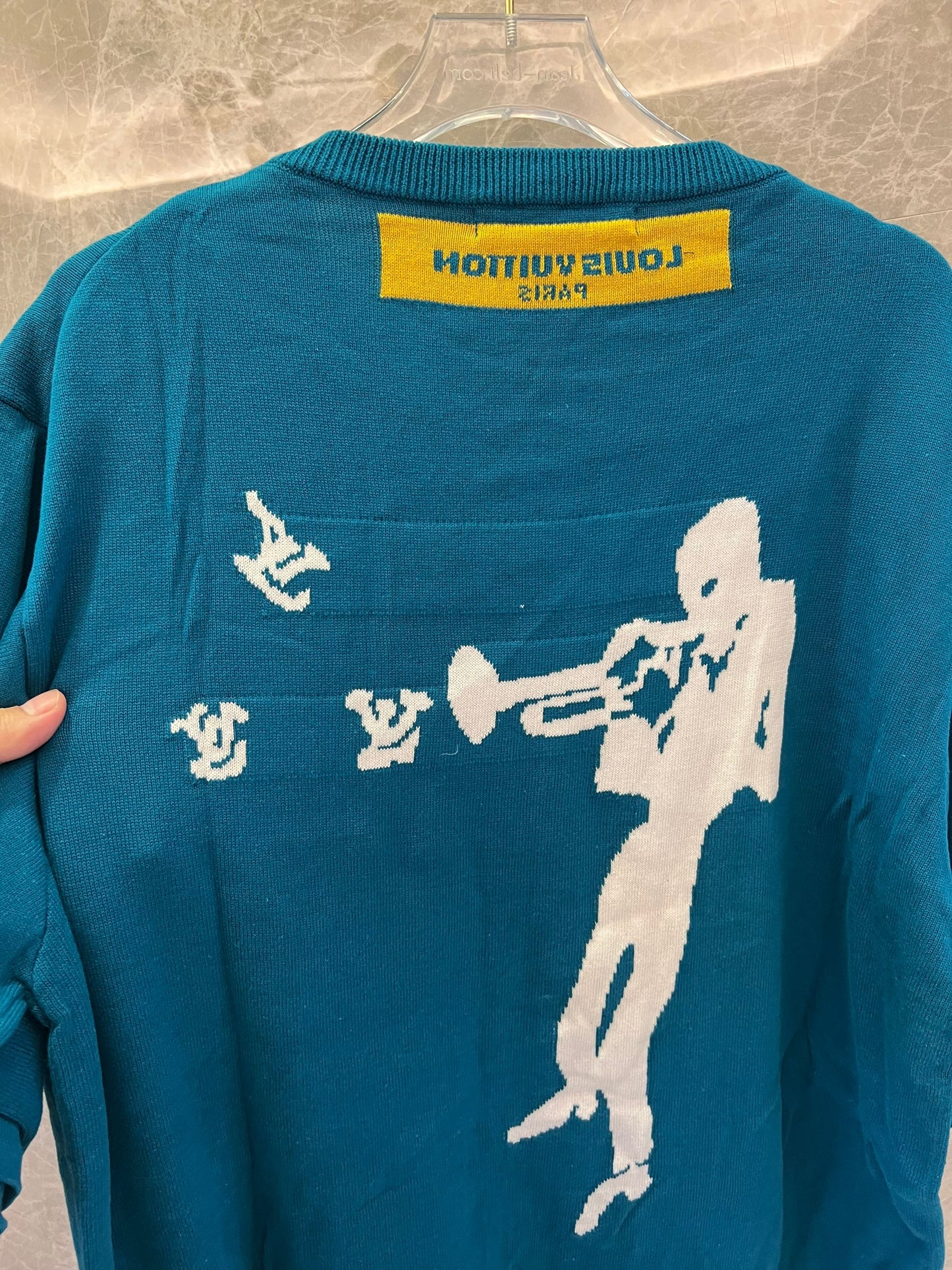 Louis Vuitton teal knit t-shirt with trumpeter motif and LV logos