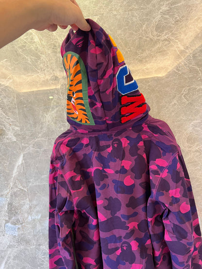 A Bathing Ape camo full-zip shark hoodie in purple and pink