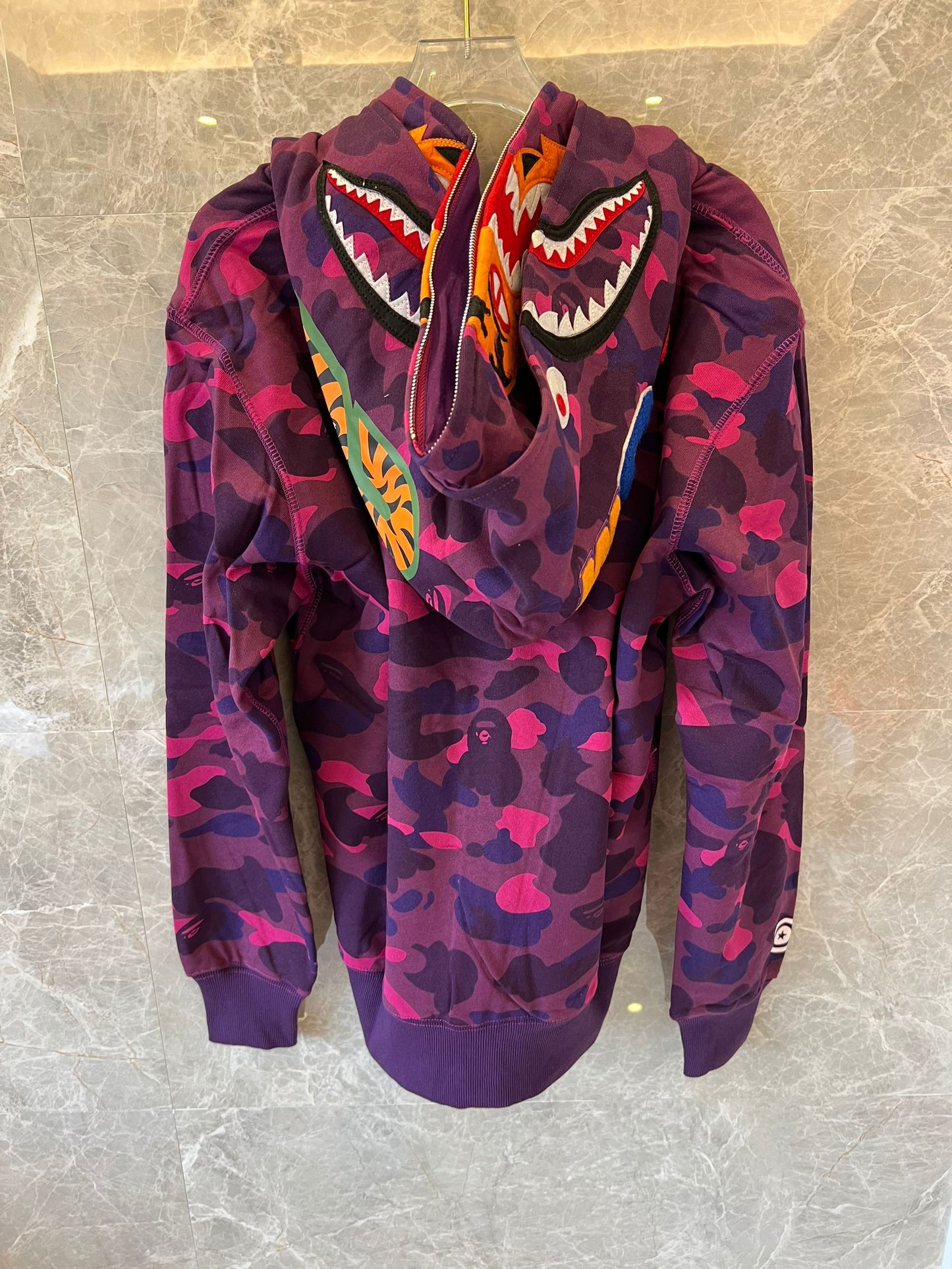 A Bathing Ape camo full-zip shark hoodie in purple and pink