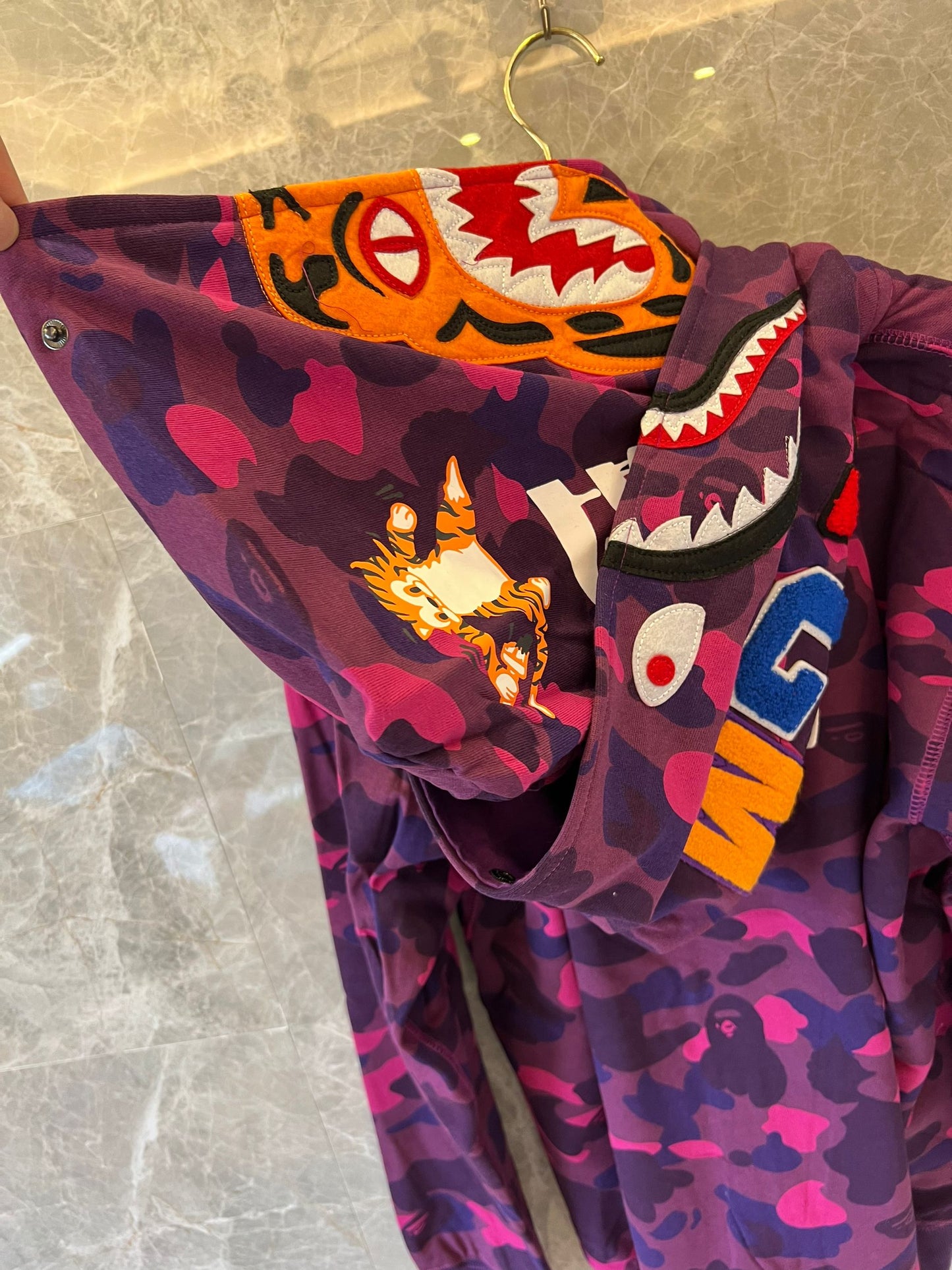 A Bathing Ape camo full-zip shark hoodie in purple and pink