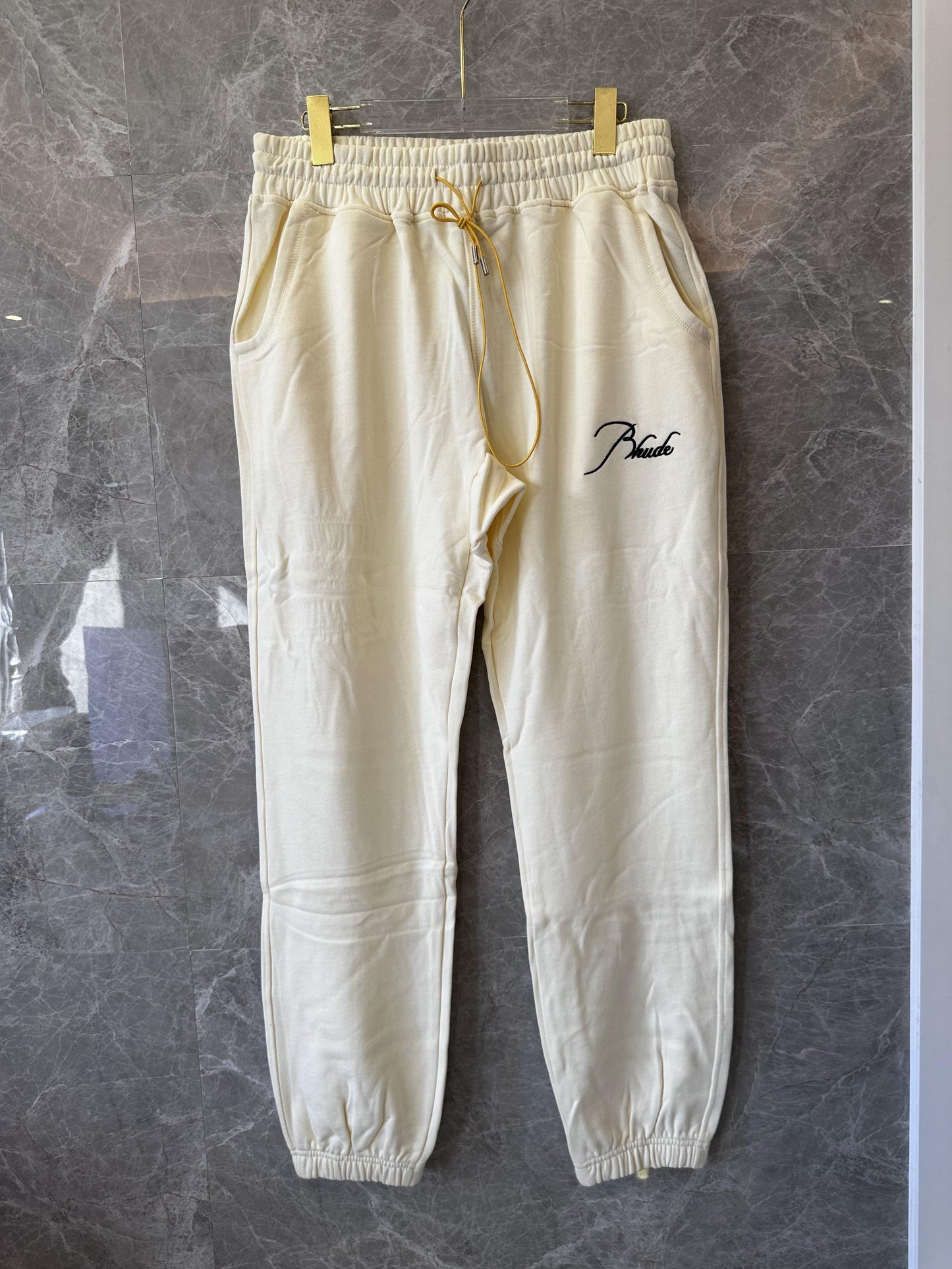 Rhude cream tracksuit set with signature embroidery