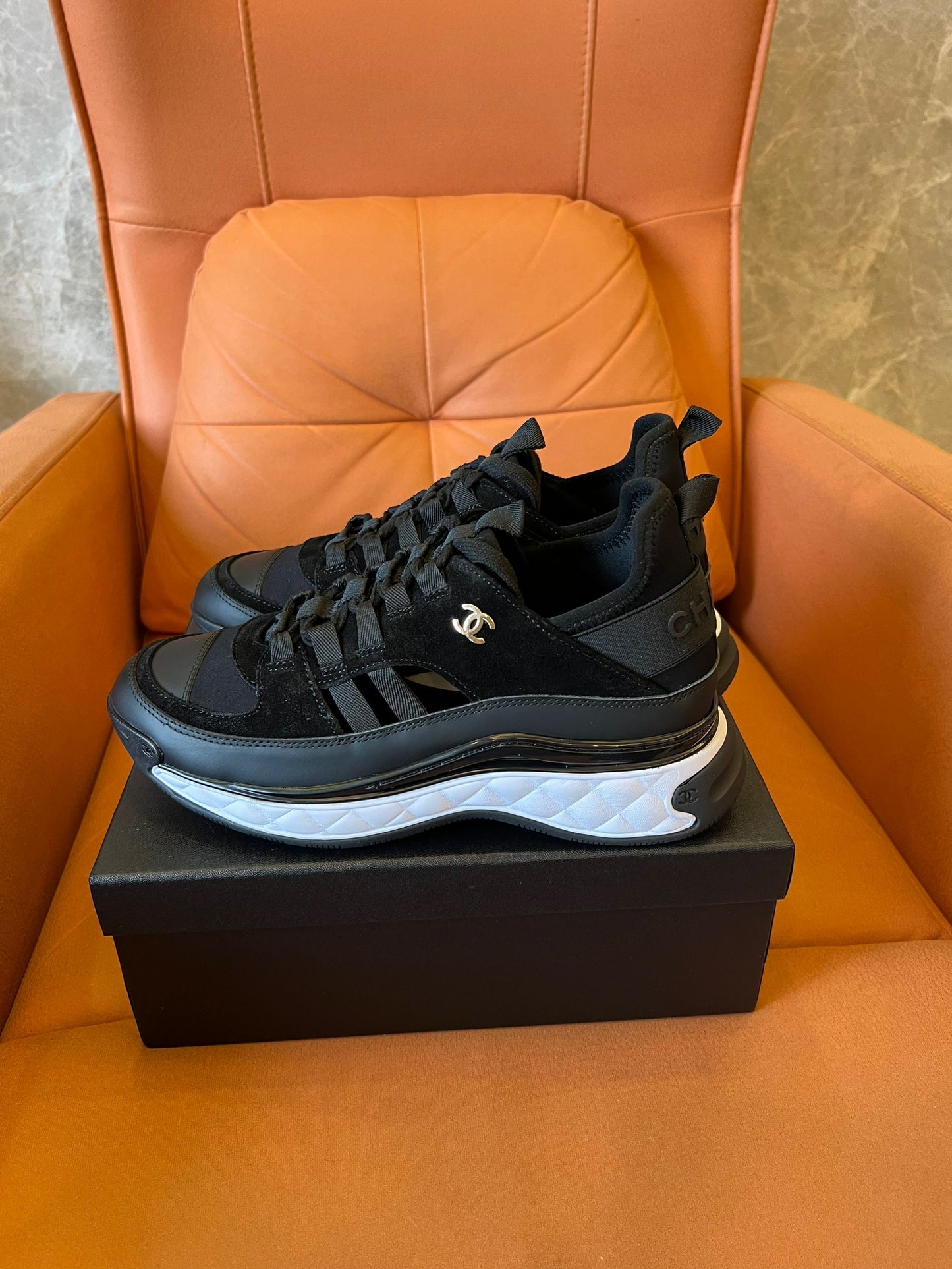 Chanel quilted sole black sneakers