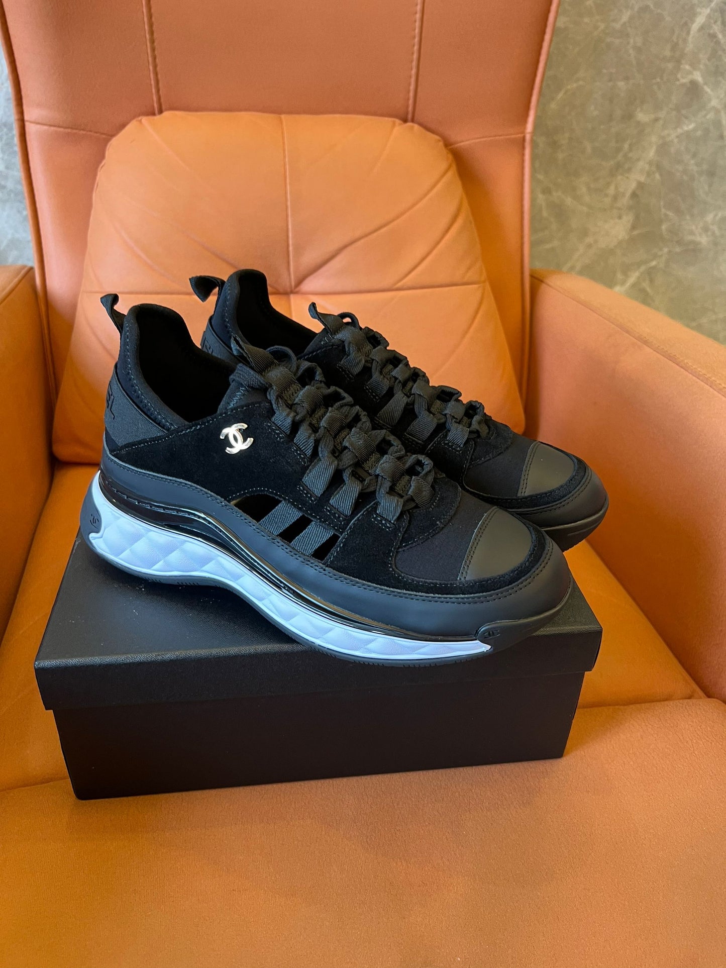 Chanel quilted sole black sneakers