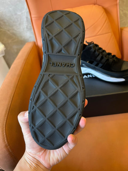 Chanel quilted sole black sneakers