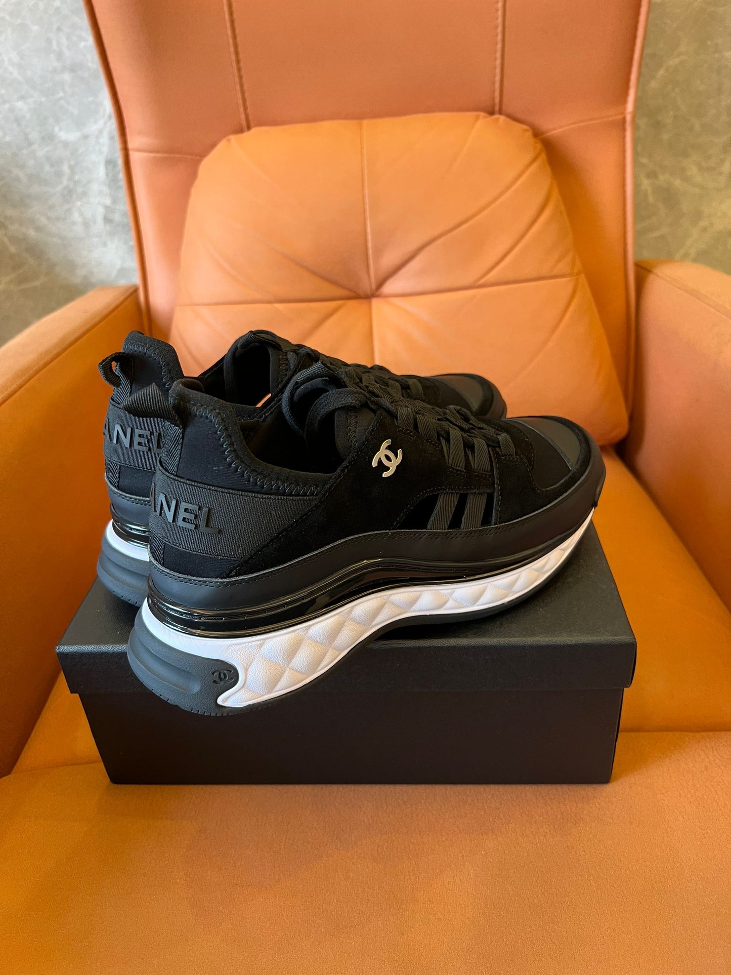 Chanel quilted sole black sneakers