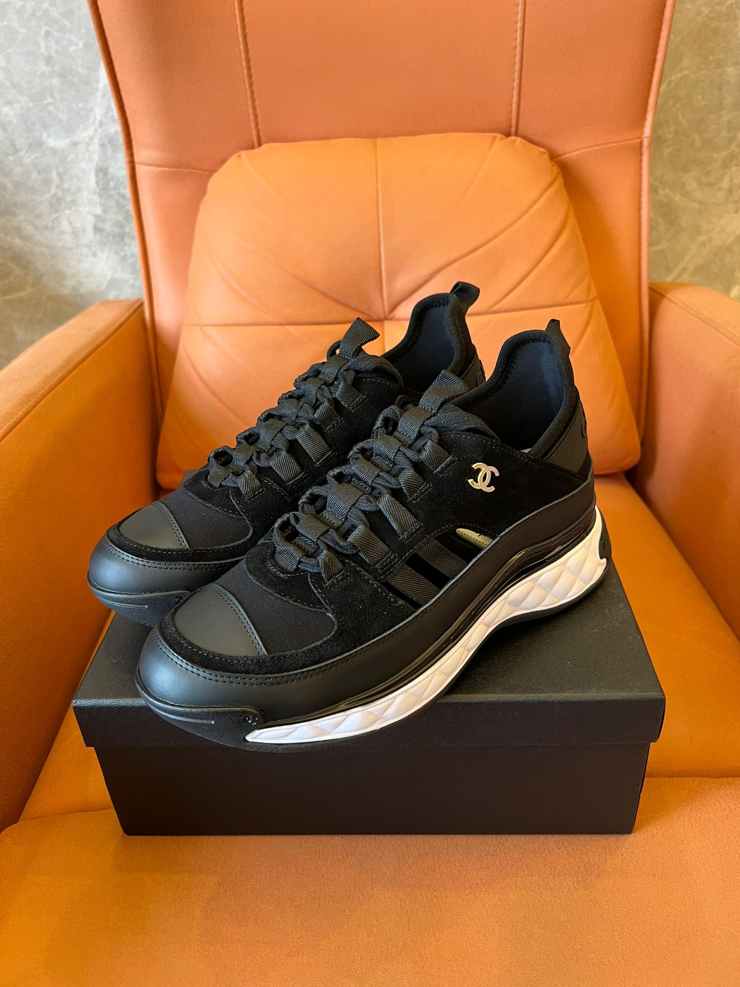 Chanel quilted sole black sneakers