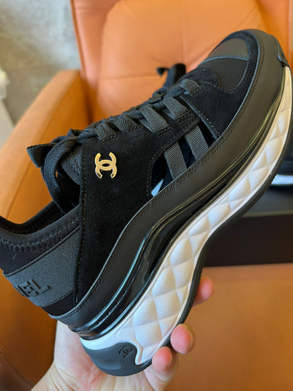 Chanel quilted sole black sneakers