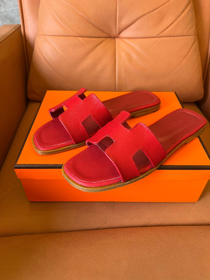 Hermès Oran slippers in rouge leather