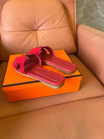 Hermès Oran slippers in rouge leather