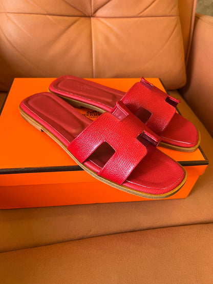 Hermès Oran slippers in rouge leather