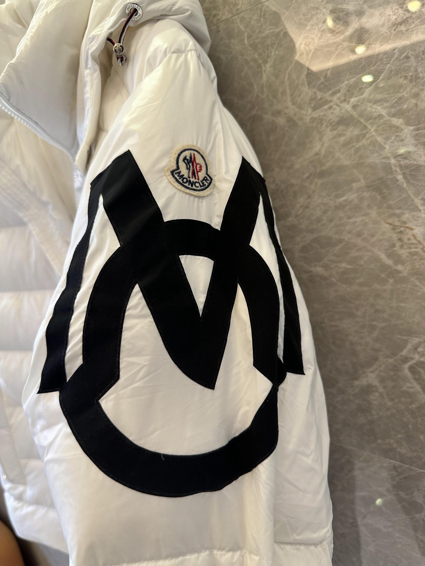 Moncler white hooded puffer jacket with black logo detail