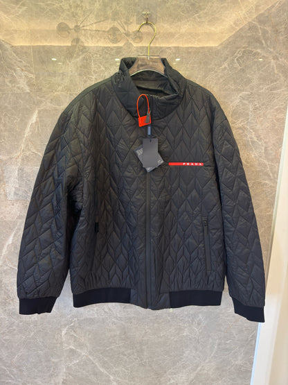 Prada black quilted jacket with red logo accent