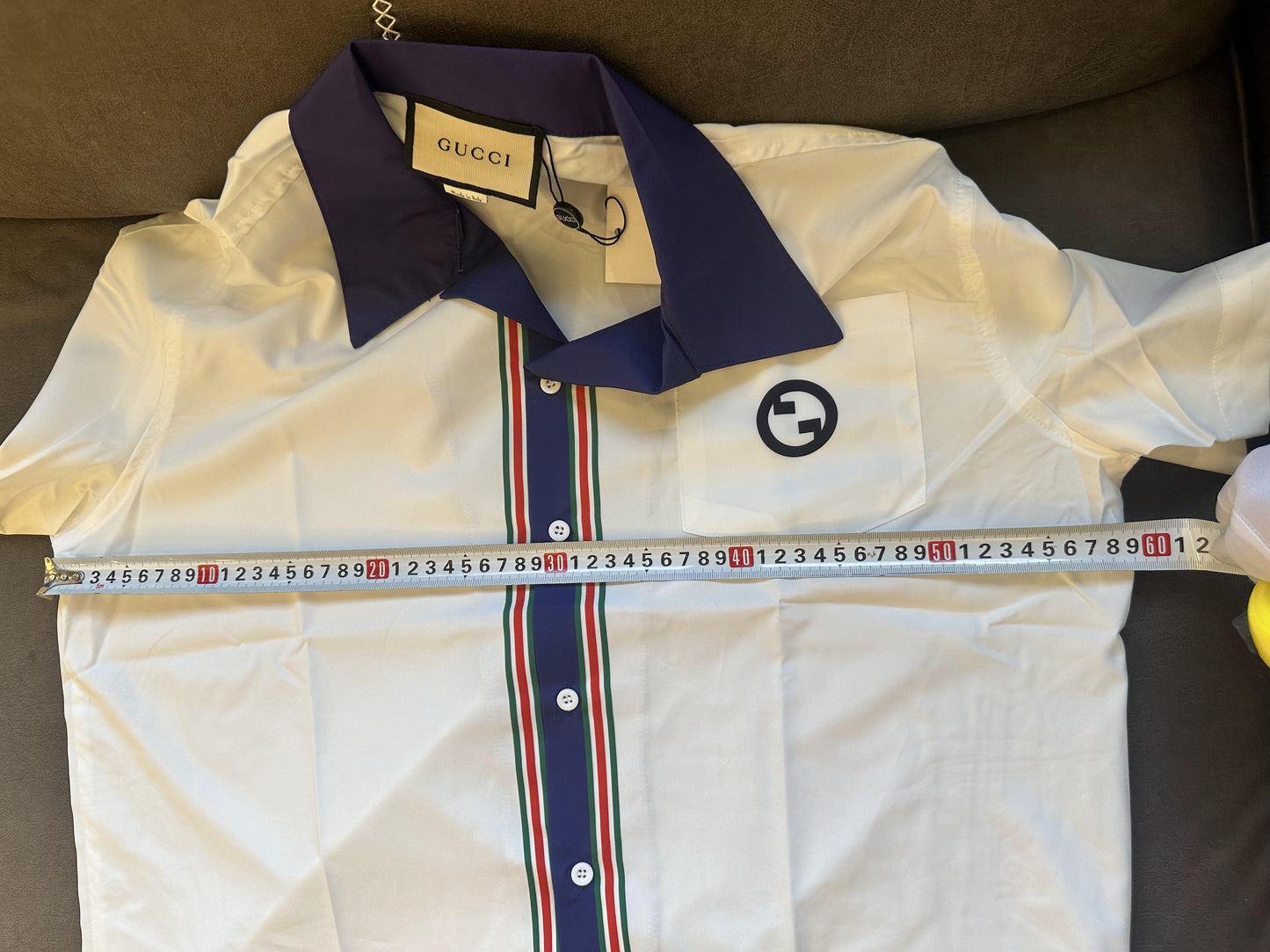 Gucci white short-sleeve buttonup shirt with navy collar and striped