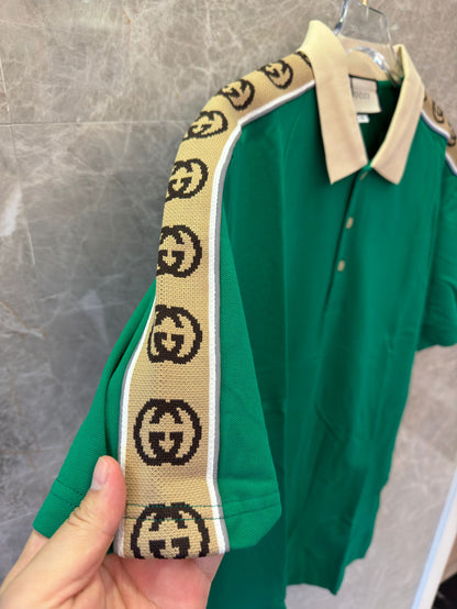 Gucci green polo shirt with signature GG tape trim