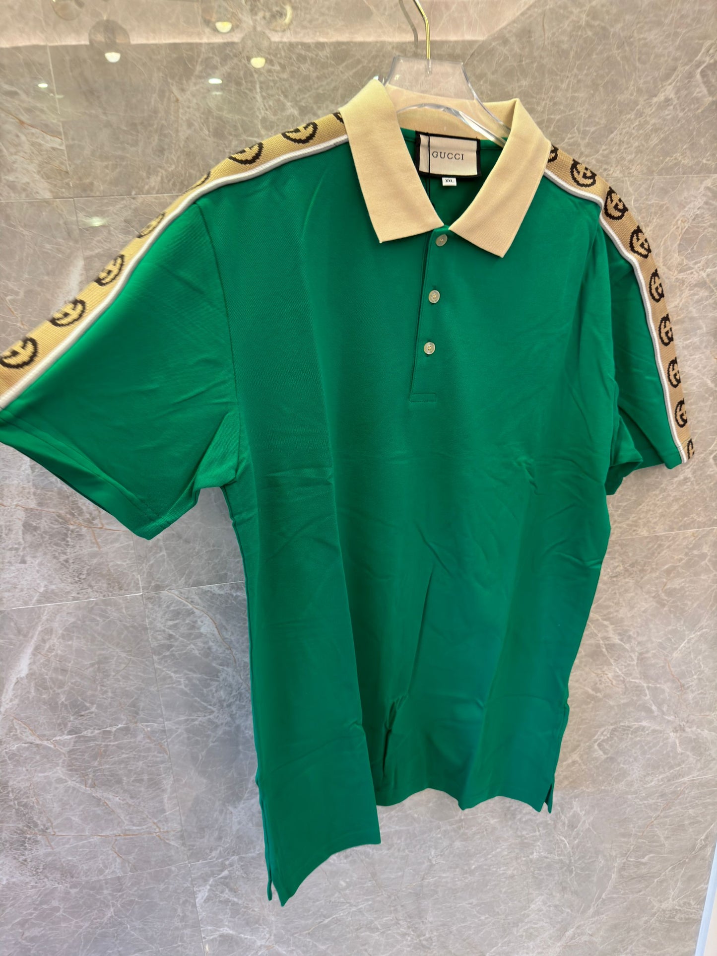 Gucci green polo shirt with signature GG tape trim