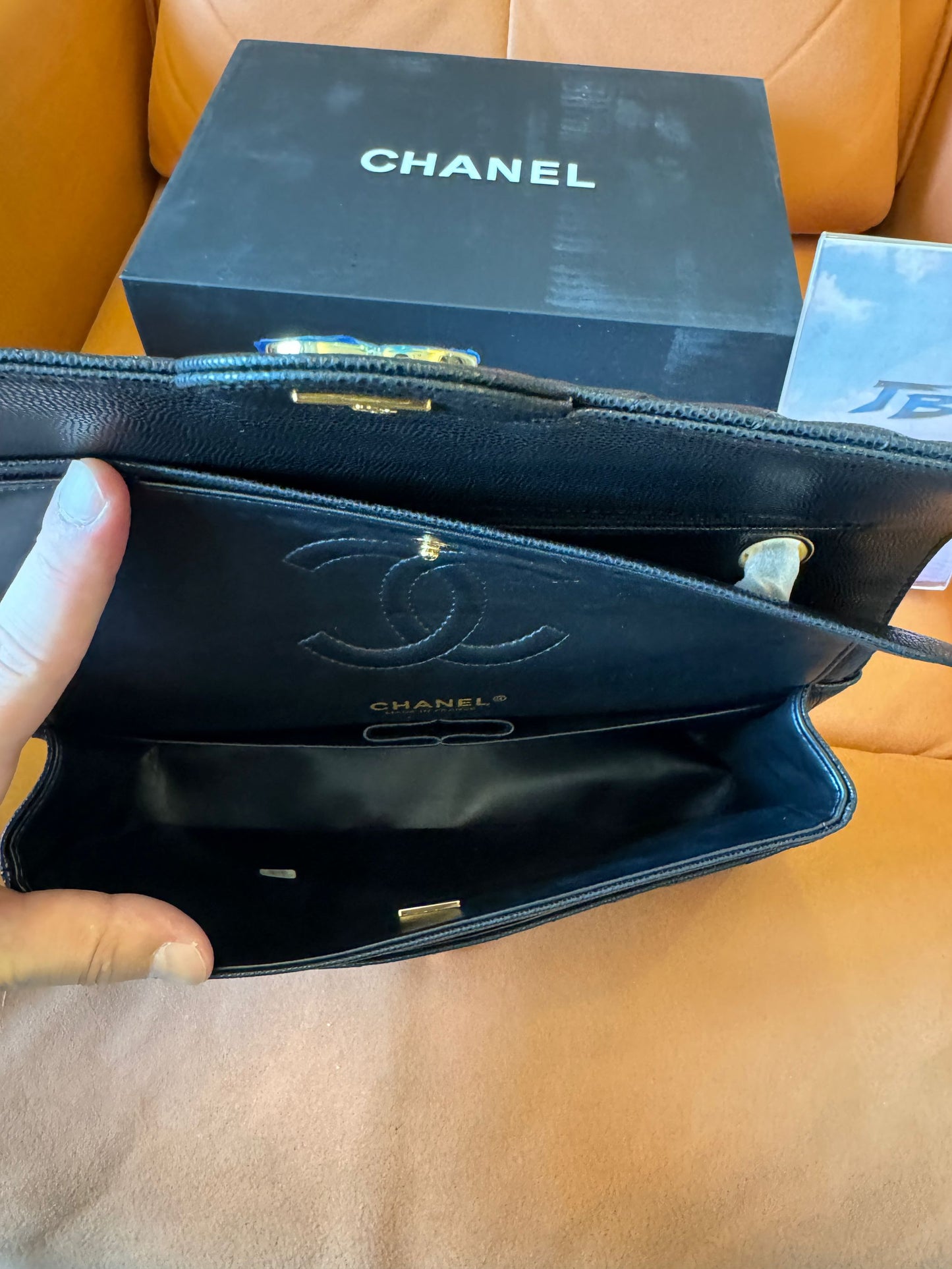 Chanel classic small black chevron caviar flap bag