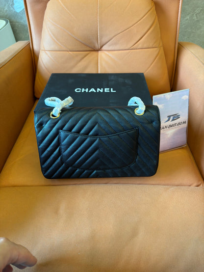 Chanel classic small black chevron caviar flap bag