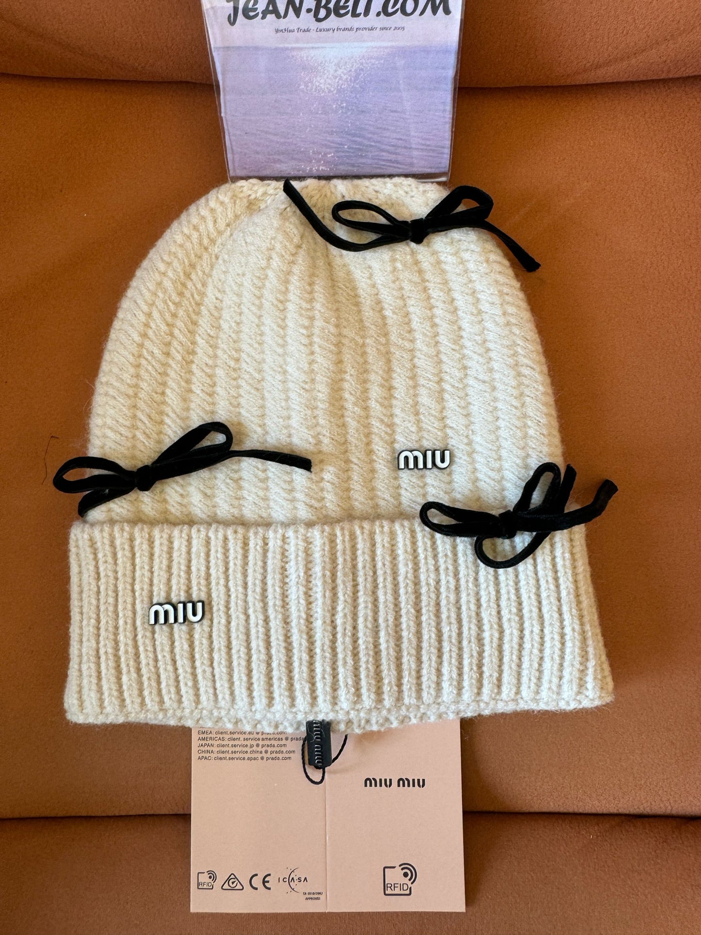 Miu Miu knitted wool beanie with bow details