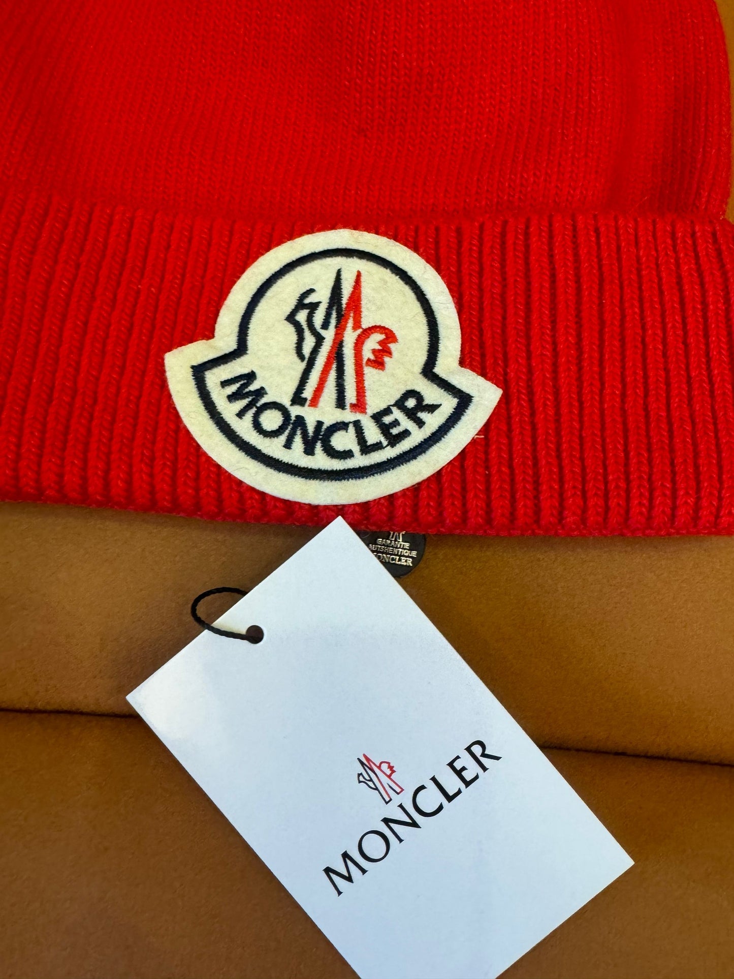 Moncler red wool beanie with iconic logo patch