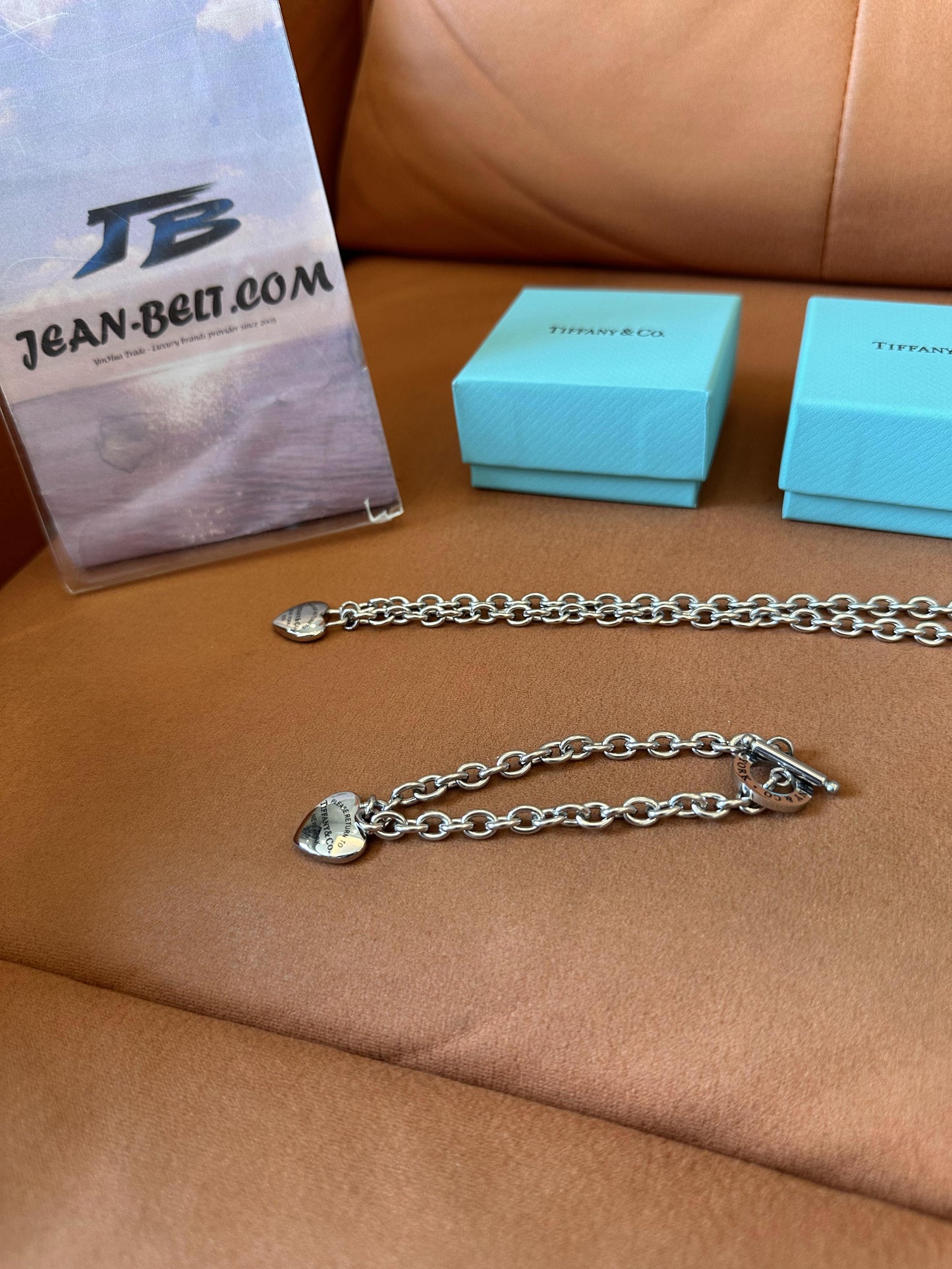 Tiffany & Co. heart and circle charm bracelet, earrings, and necklace set in sterling silver