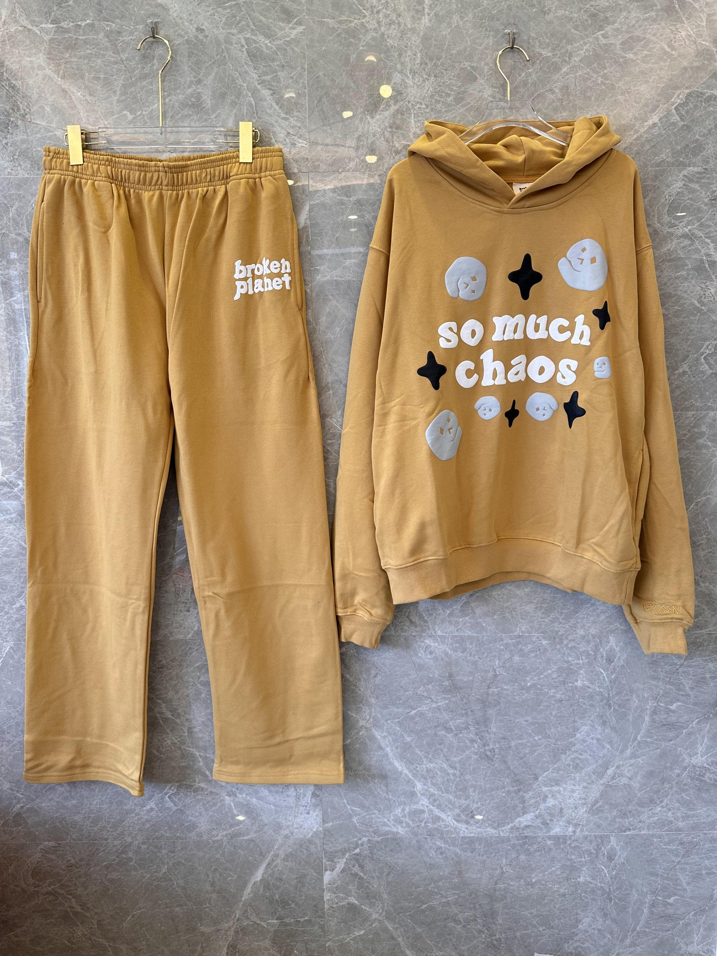 Broken Planet “So Much Chaos” hoodie and jogger set in caramel brown