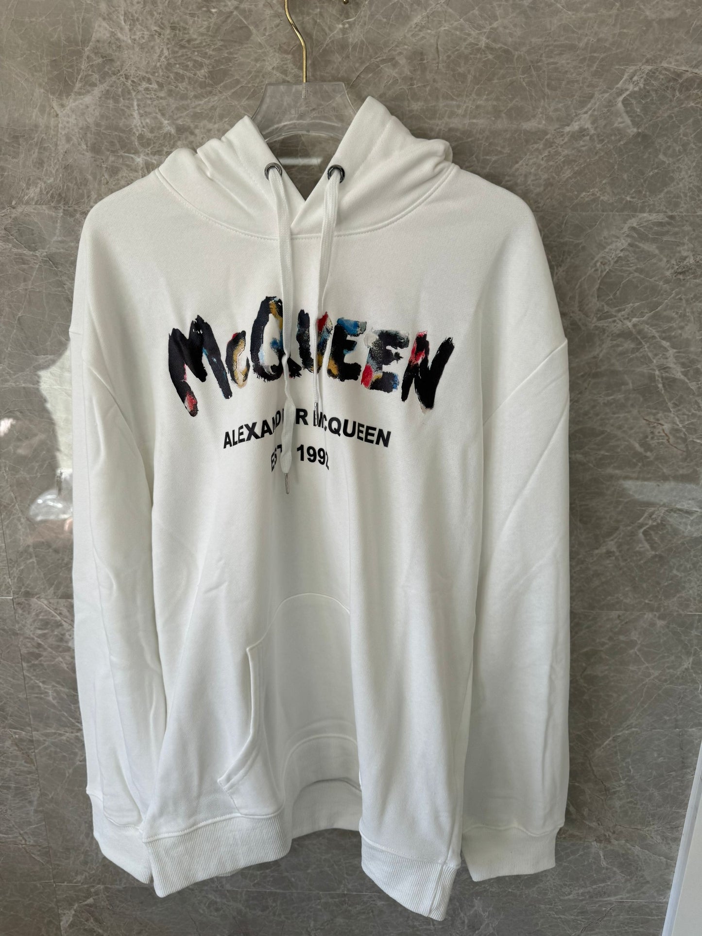 Alexander McQueen white distressed logo hoodie with color accents