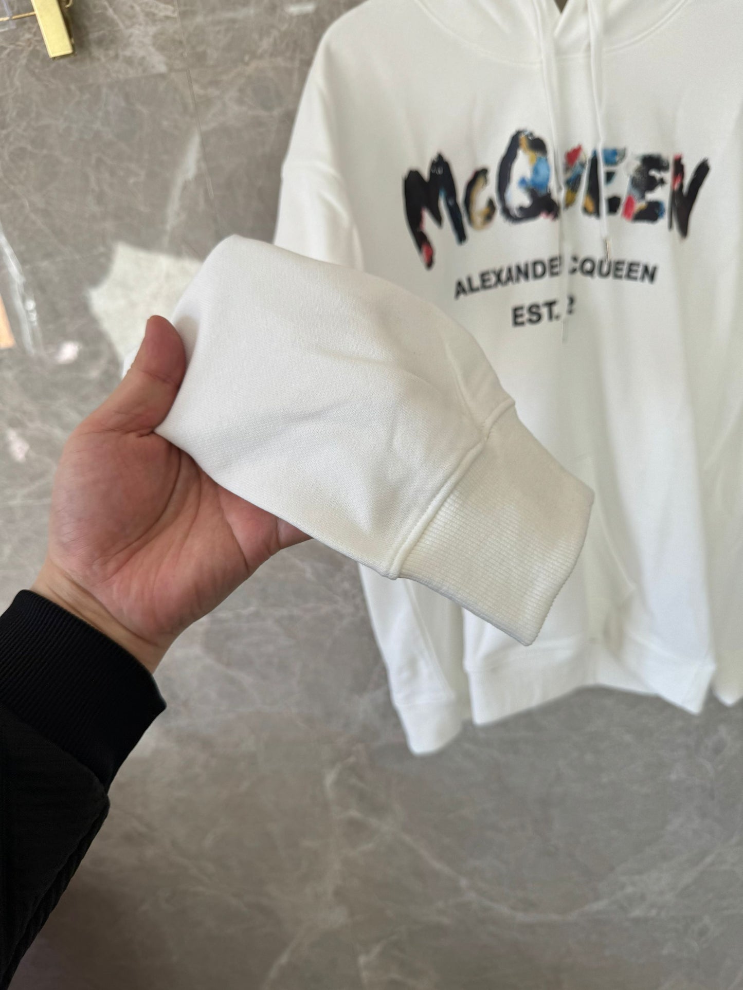 Alexander McQueen white distressed logo hoodie with color accents