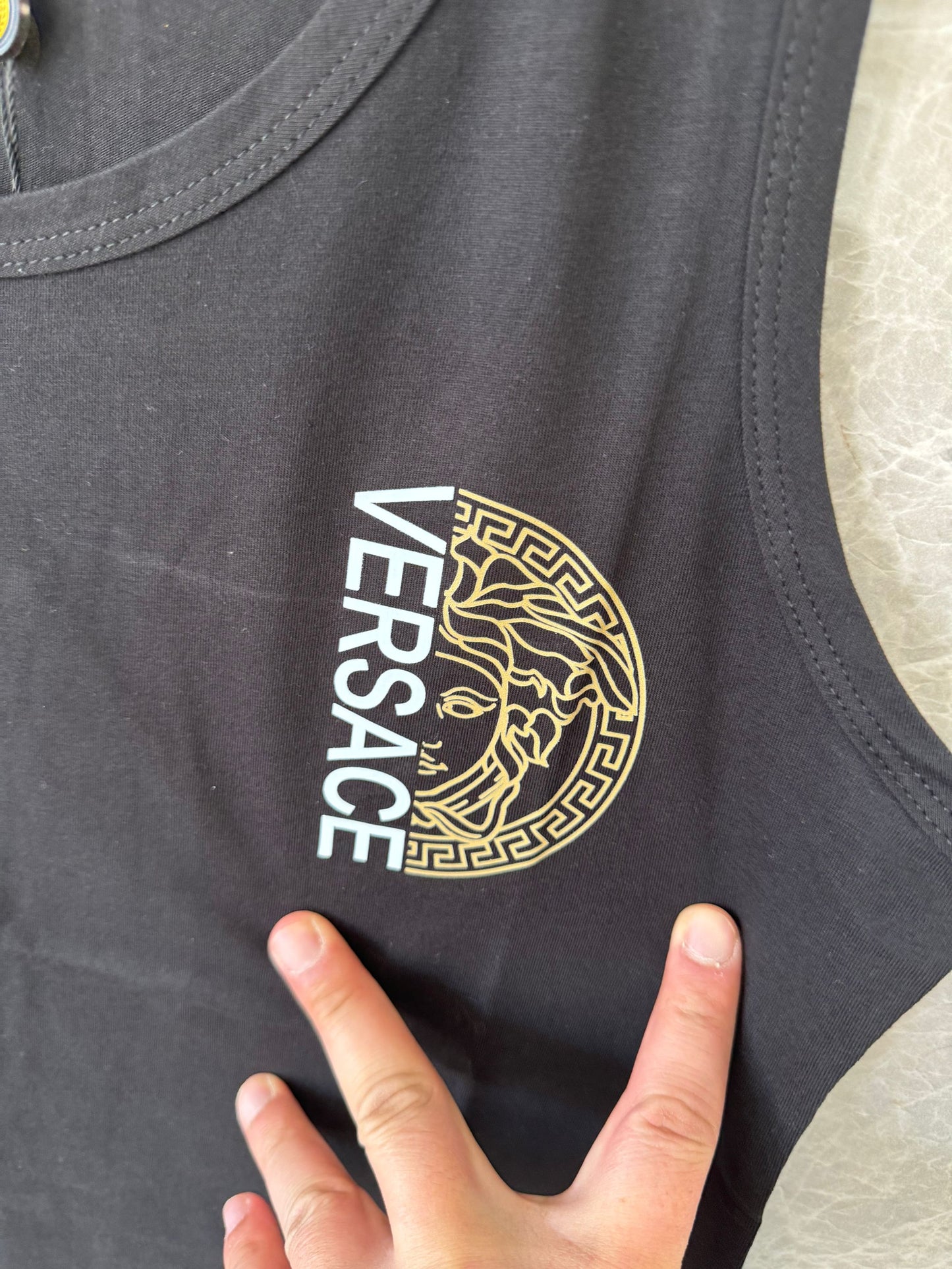 Versace black sleeveless top with medusa logo