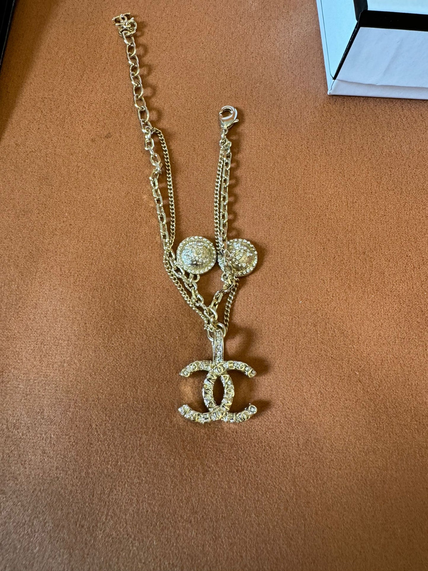 Chanel crystal logo earrings, necklace, and bracelet set