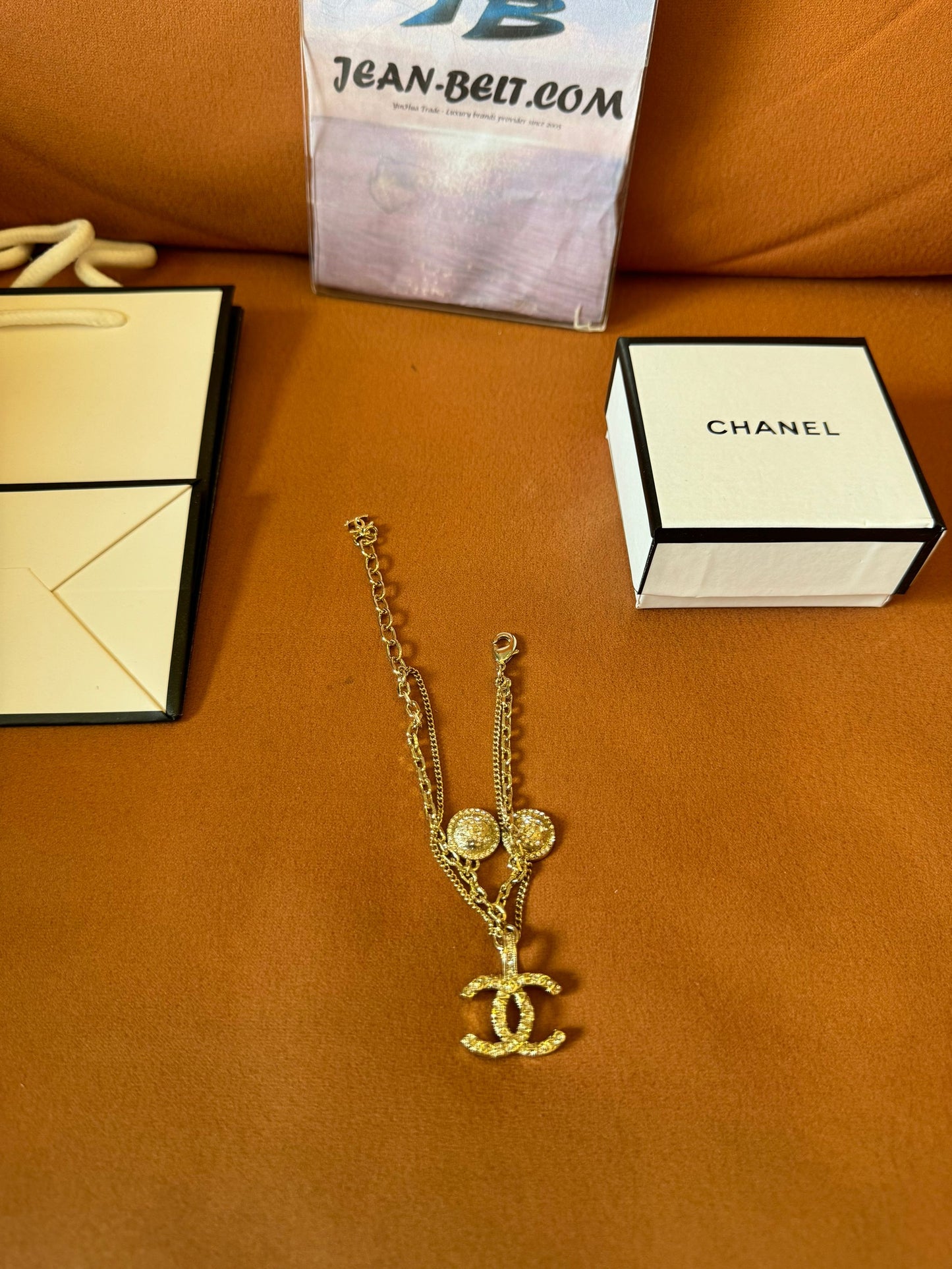 Chanel crystal logo earrings, necklace, and bracelet set