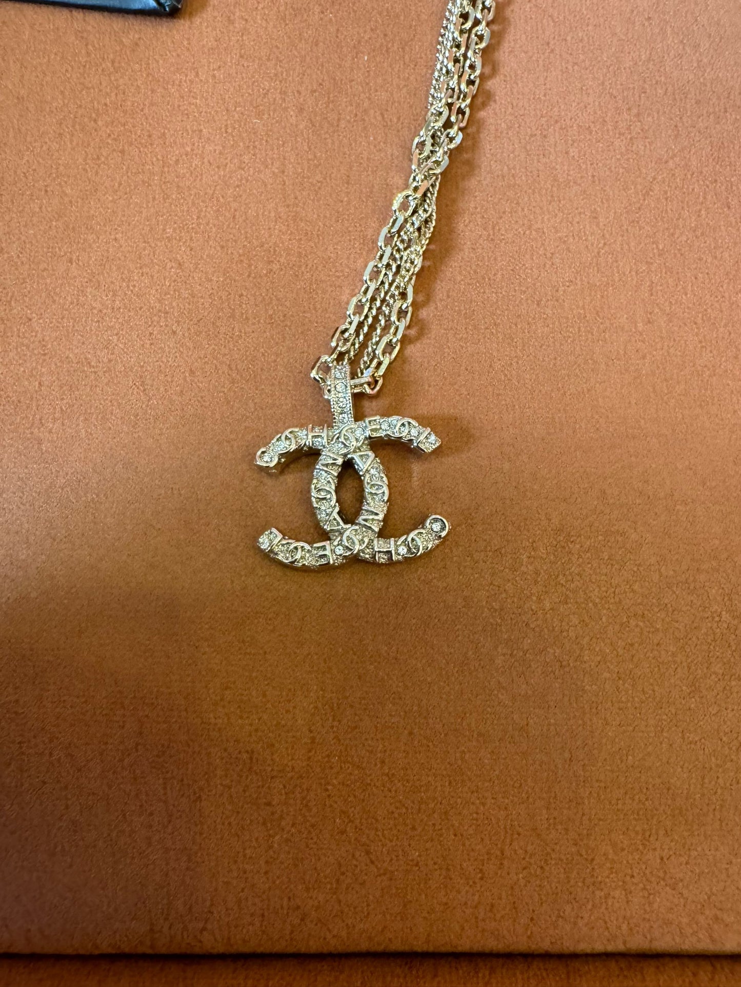 Chanel crystal logo earrings, necklace, and bracelet set