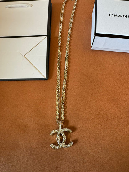 Chanel crystal logo earrings, necklace, and bracelet set