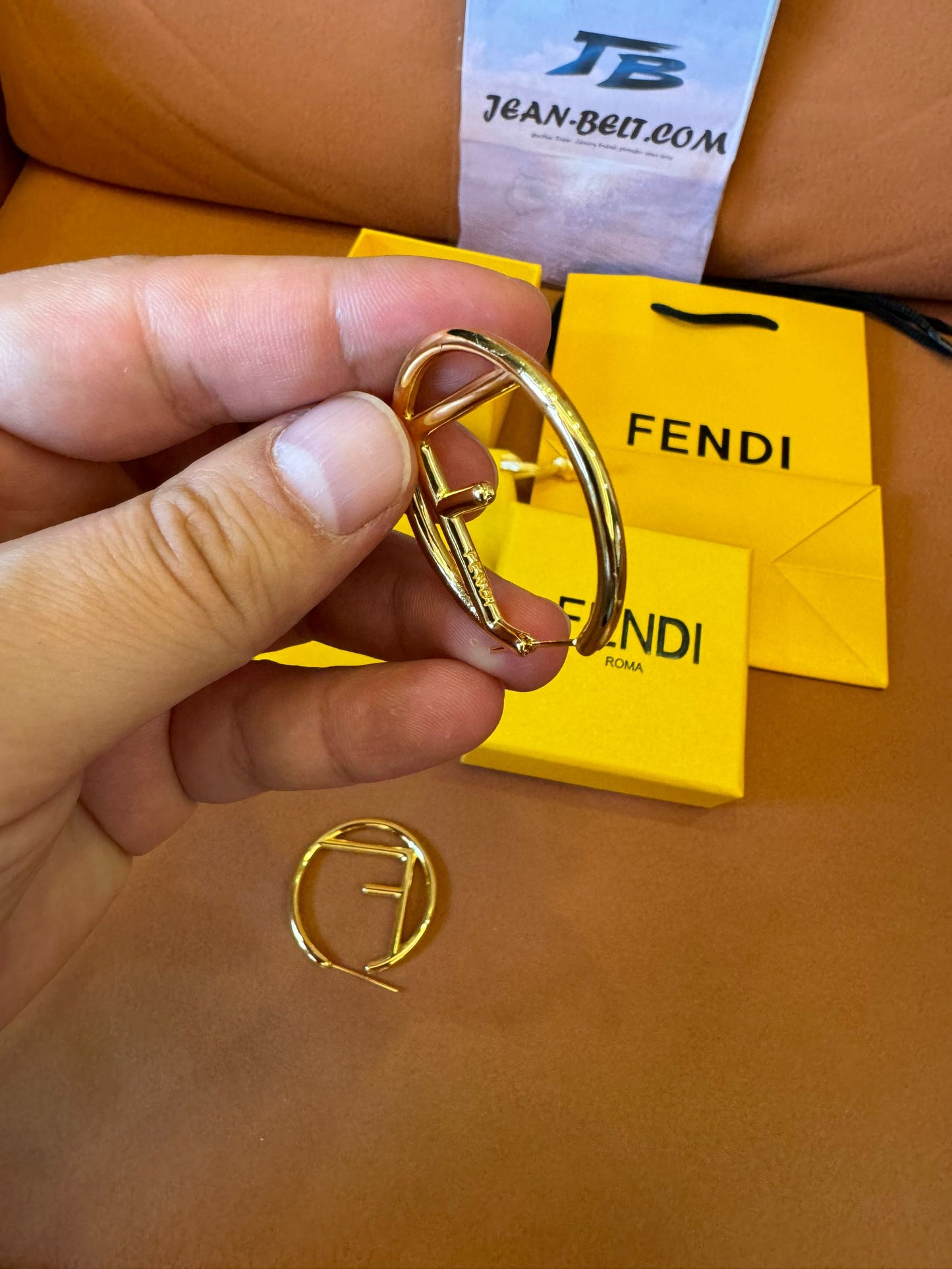 Fendi logo hoop earrings in gold-tone