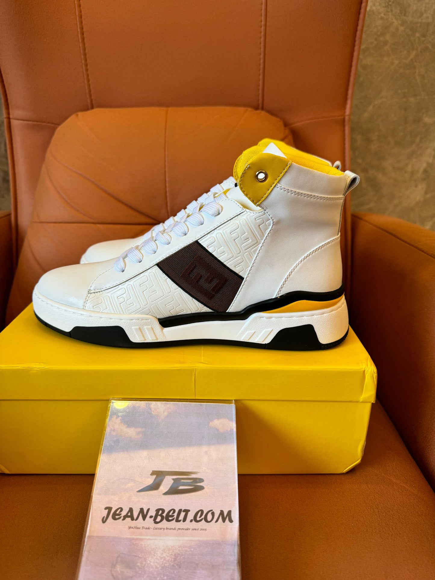 Fendi high-top white leather sneakers with yellow detail and FF logo