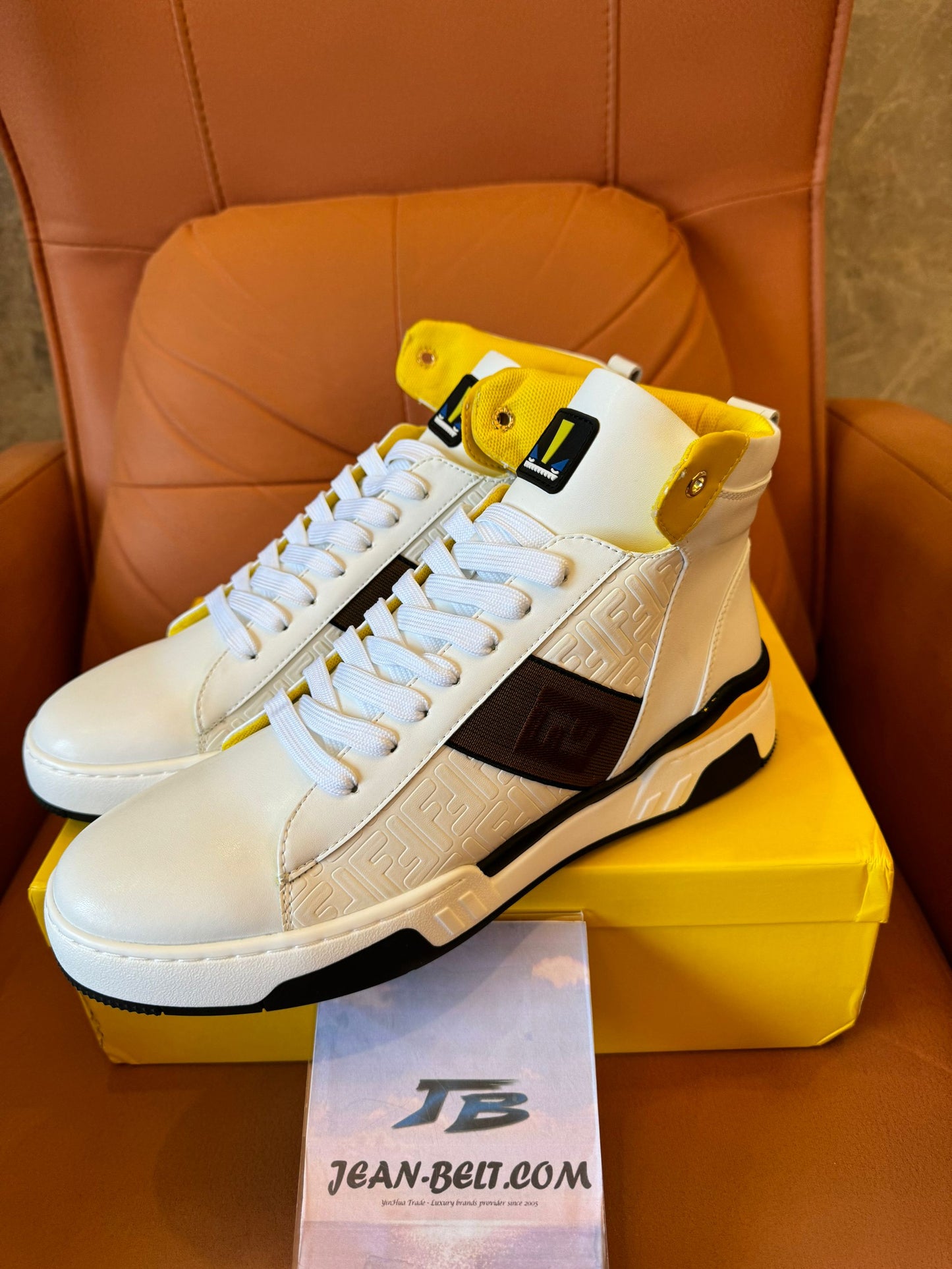 Fendi high-top white leather sneakers with yellow detail and FF logo