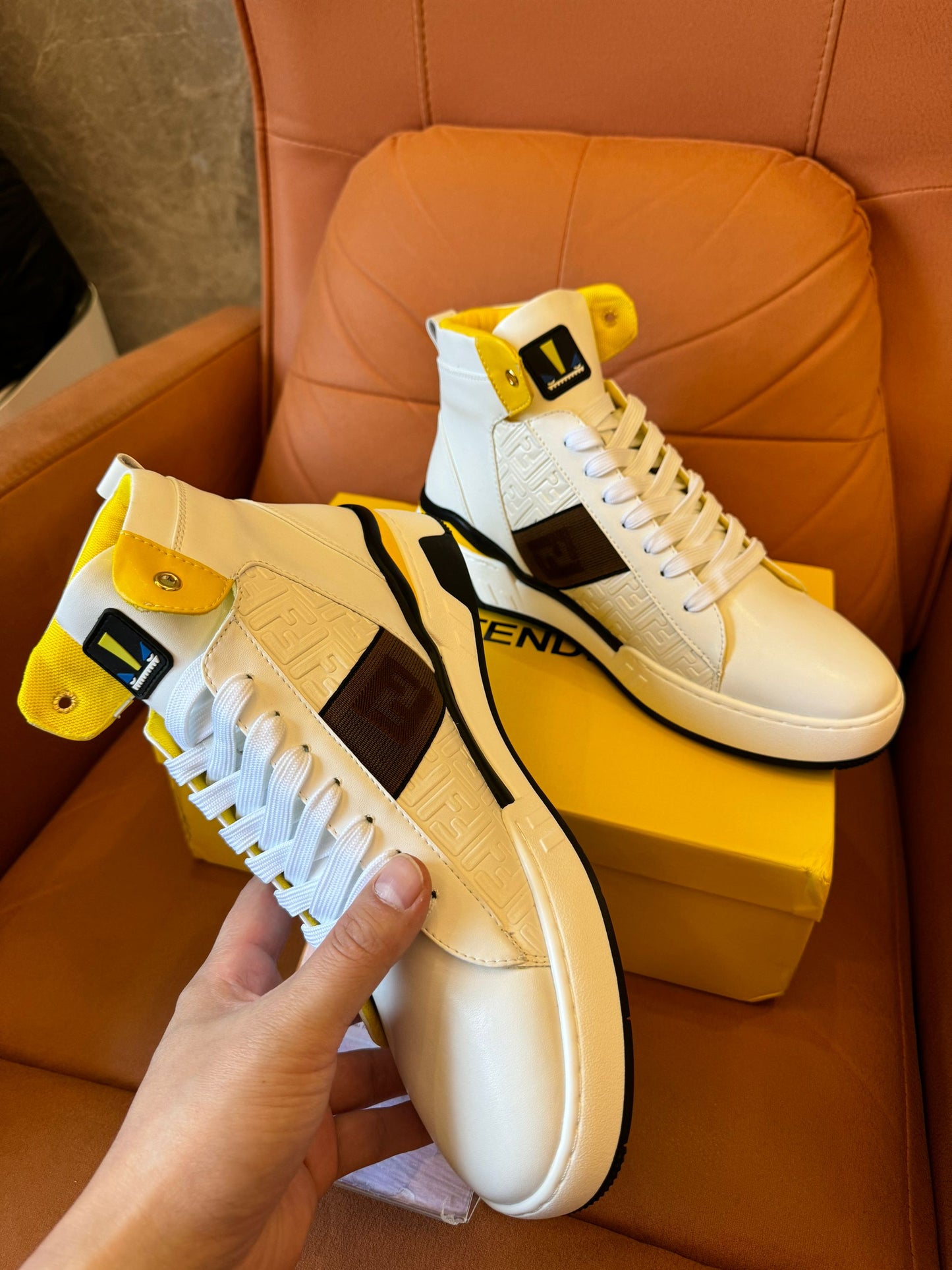 Fendi high-top white leather sneakers with yellow detail and FF logo