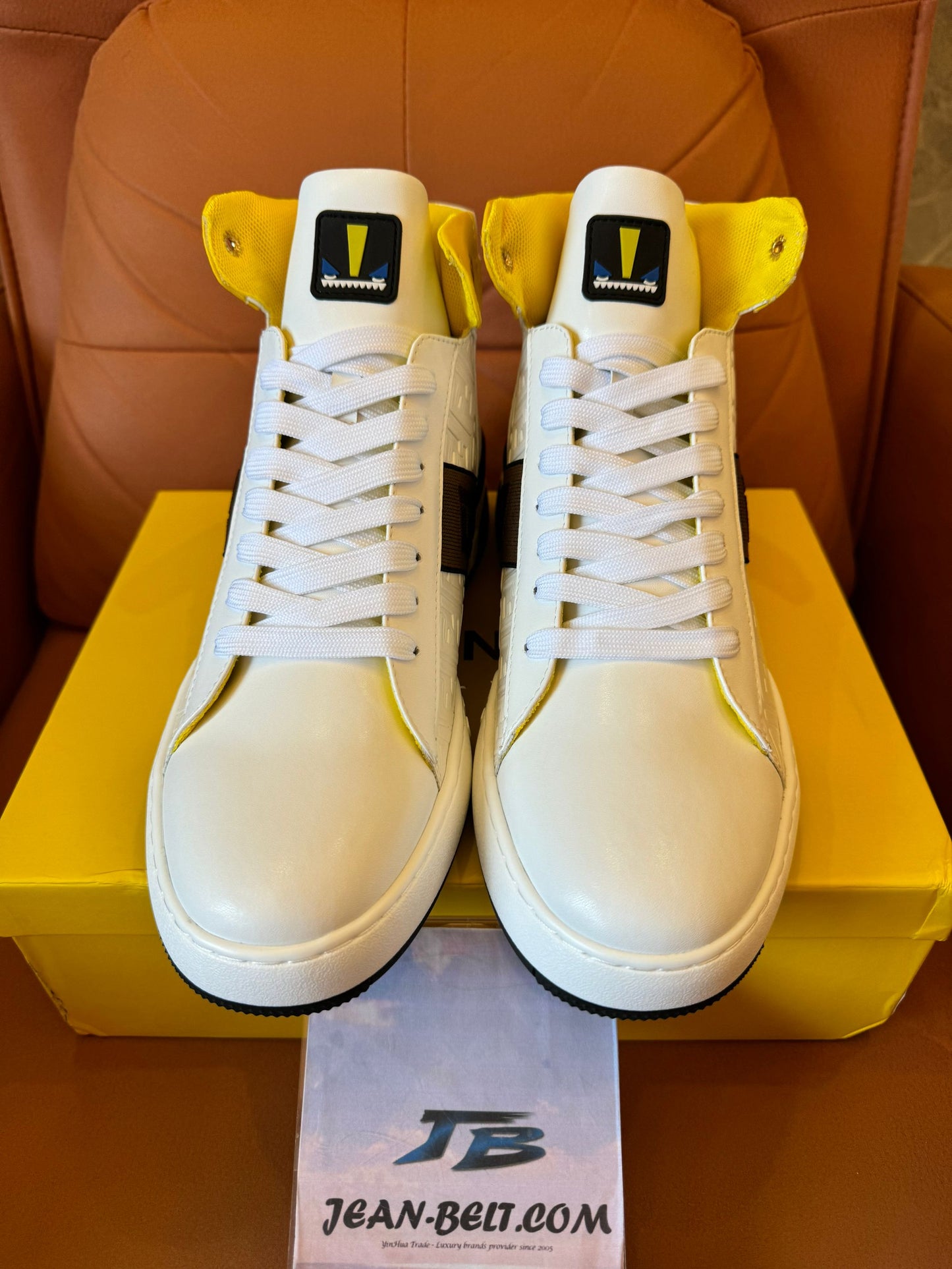 Fendi high-top white leather sneakers with yellow detail and FF logo