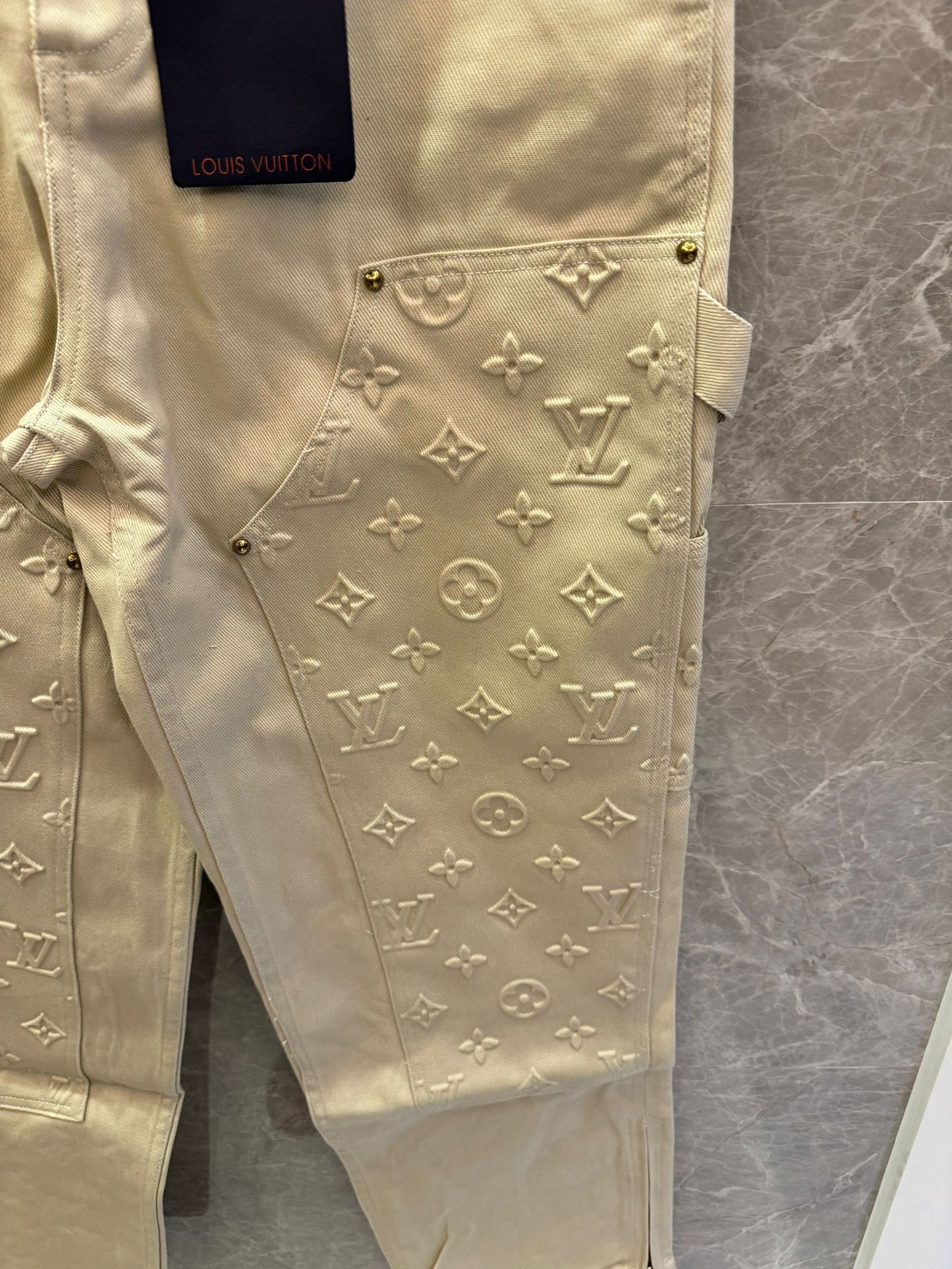 Louis Vuitton beige embossed monogram denim pants