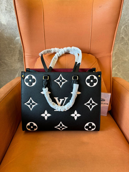 Louis Vuitton on the go mm tote bag bicolor empreinte leather